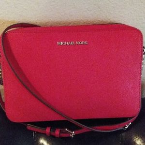 Michael Kors red chain crossbody purse.